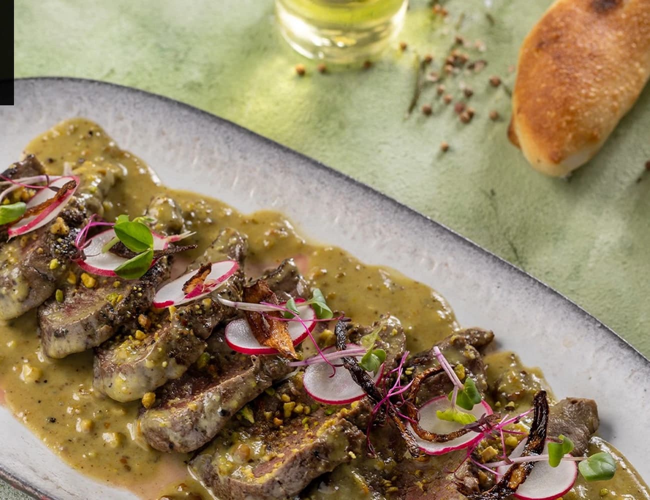 Fillet Pistachio — plated entrée at ZEST